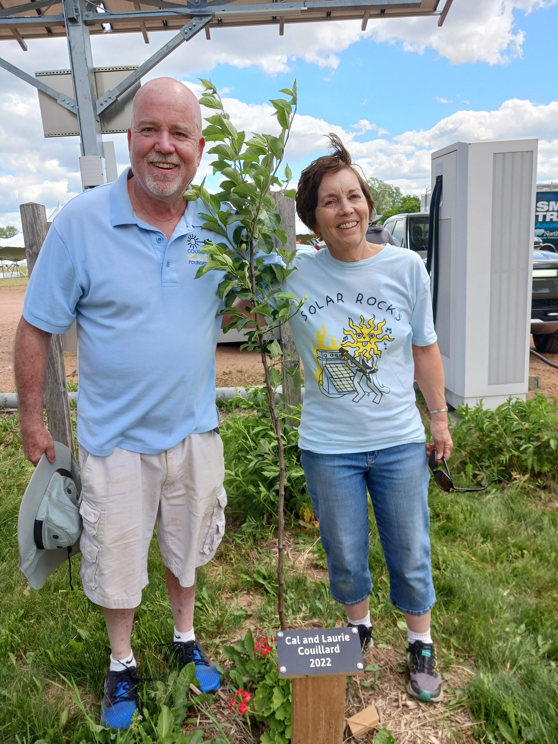 Cal and Laurie Couillard with their MREA Avenue of Advocates tree awarded in 2022.